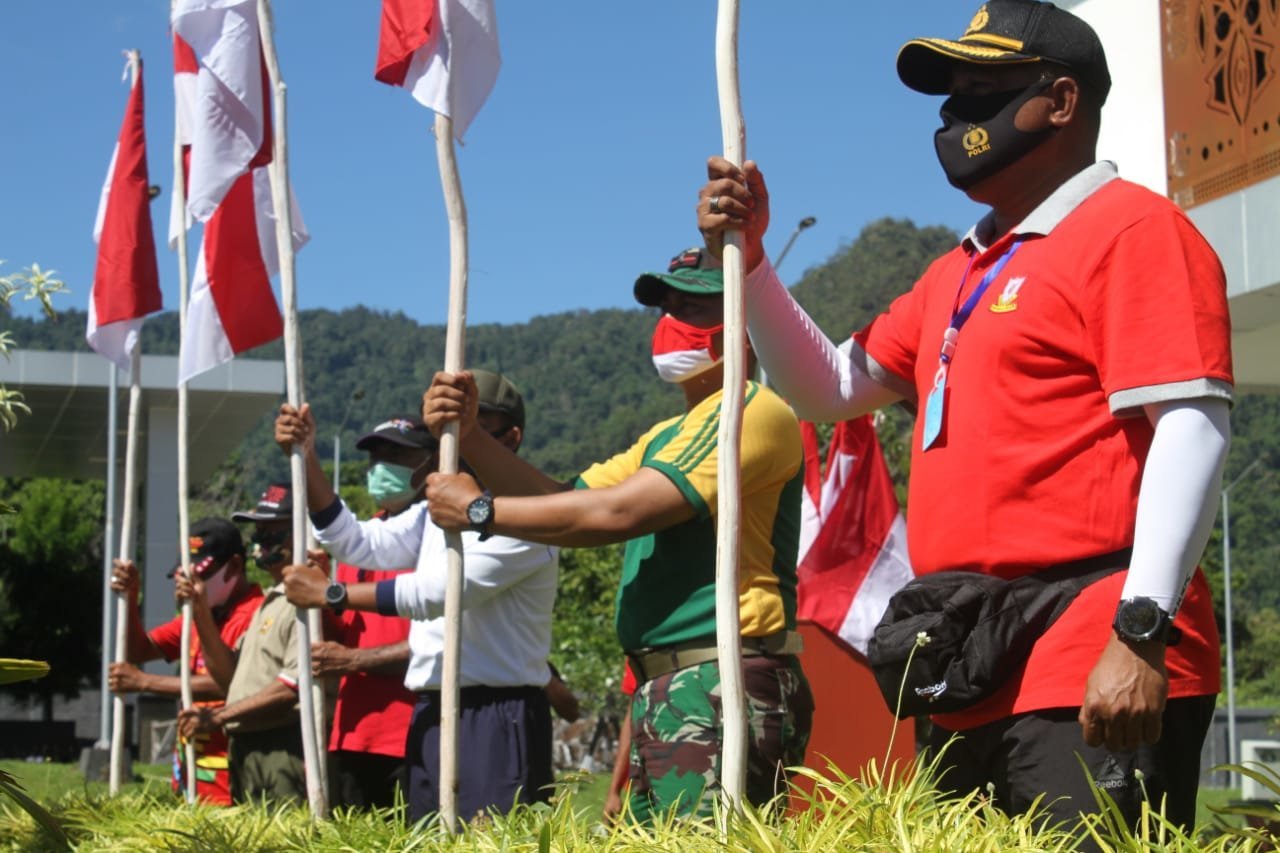 ratusan-anggota-tni-polri-dan-asn-kota-jayapura-gelar-karya-bhakti-di-batas-negara-skouw-2208069-rev2.jpg
